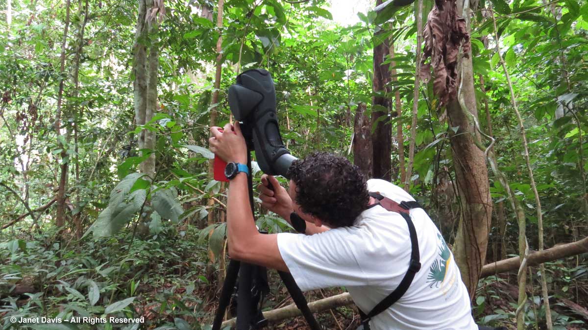 Felix-using scope in rainforest-El Remanso